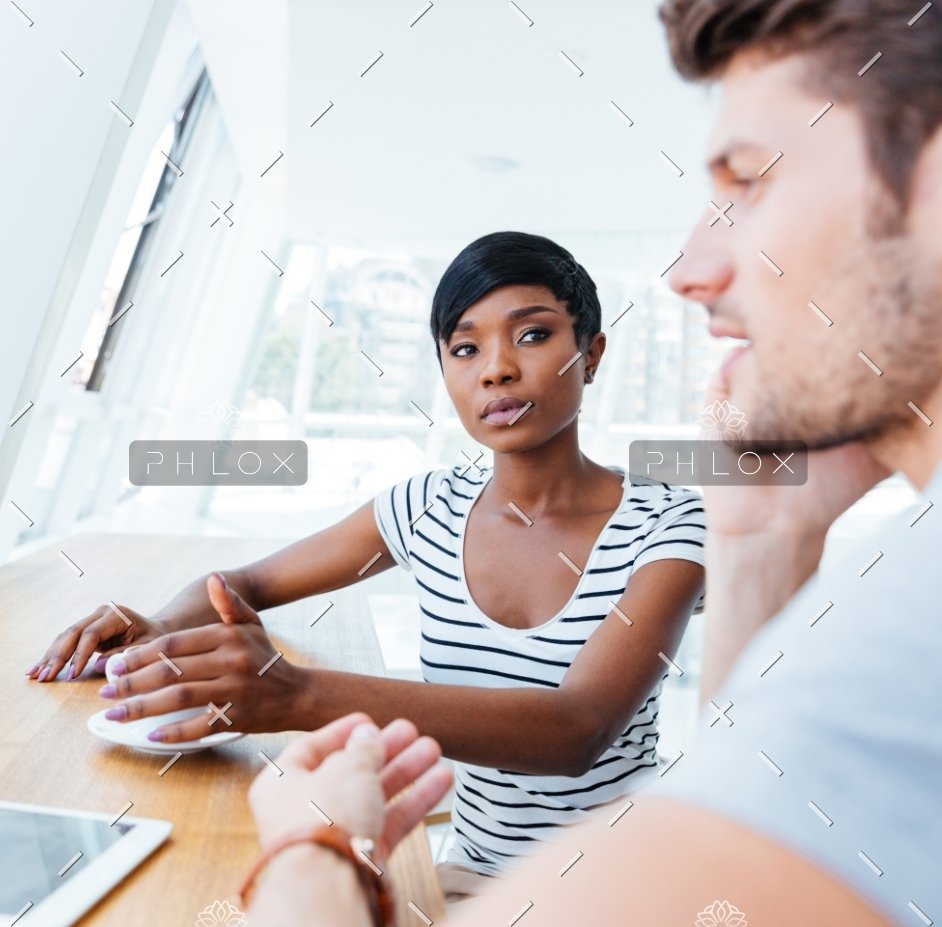 About demo-attachment-307-Businesswoman-and-smiling-businessman-discussing-work-in-restaurant@2x