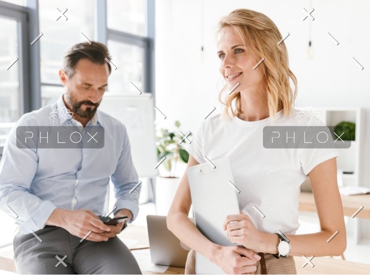 About demo-attachment-328-confident-man-manager-using-mobile-phone-PKUB4RV@2x